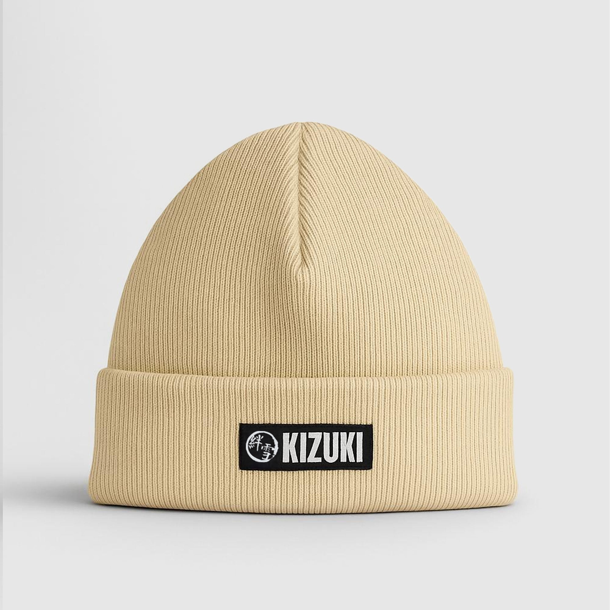Beige beanie with Kizuki logo on a light gray background