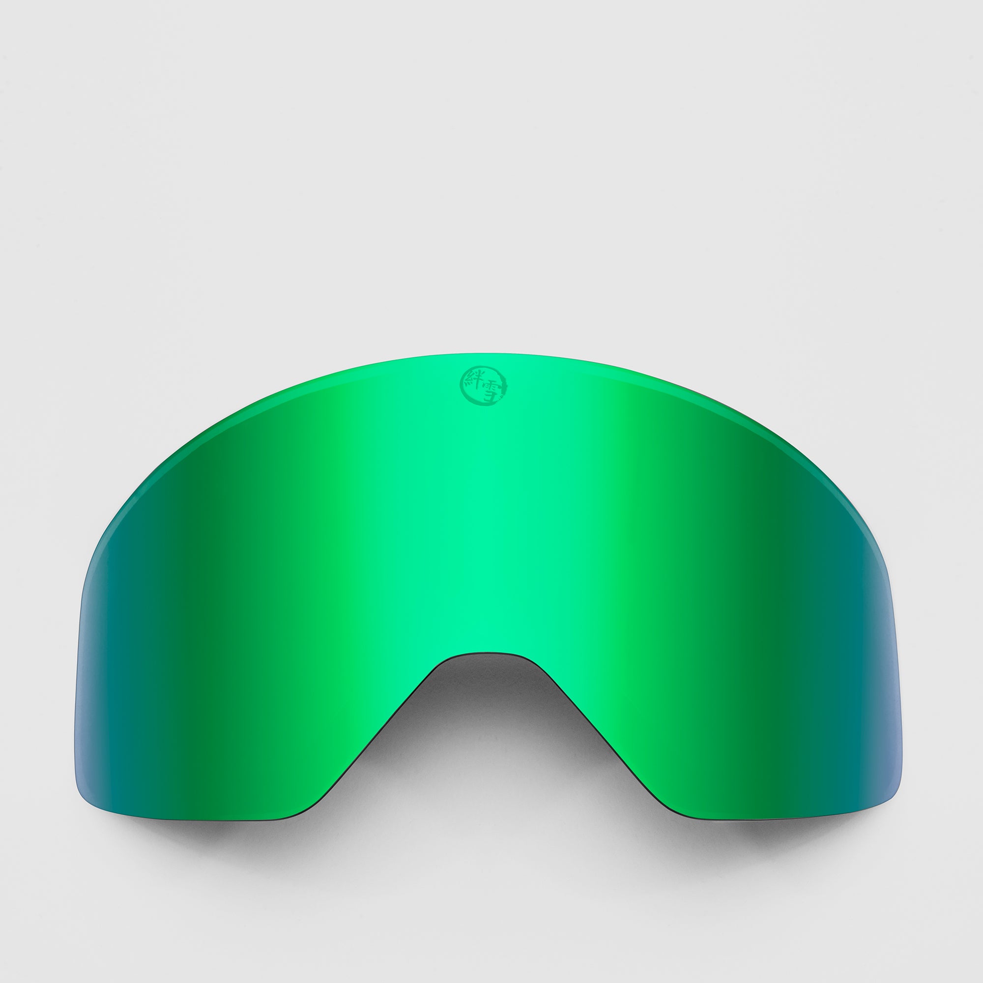 Green ski goggles lens on a light gray background