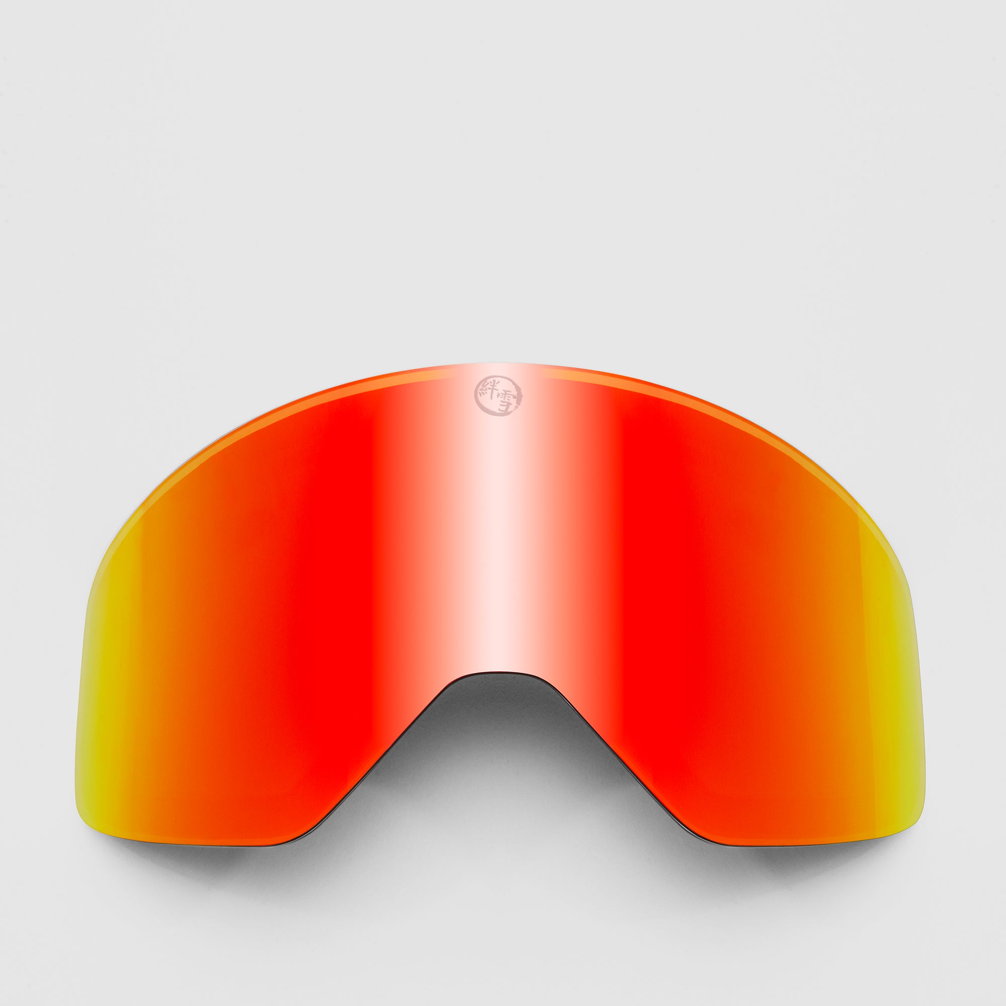 Red ski goggles lens on a light gray background
