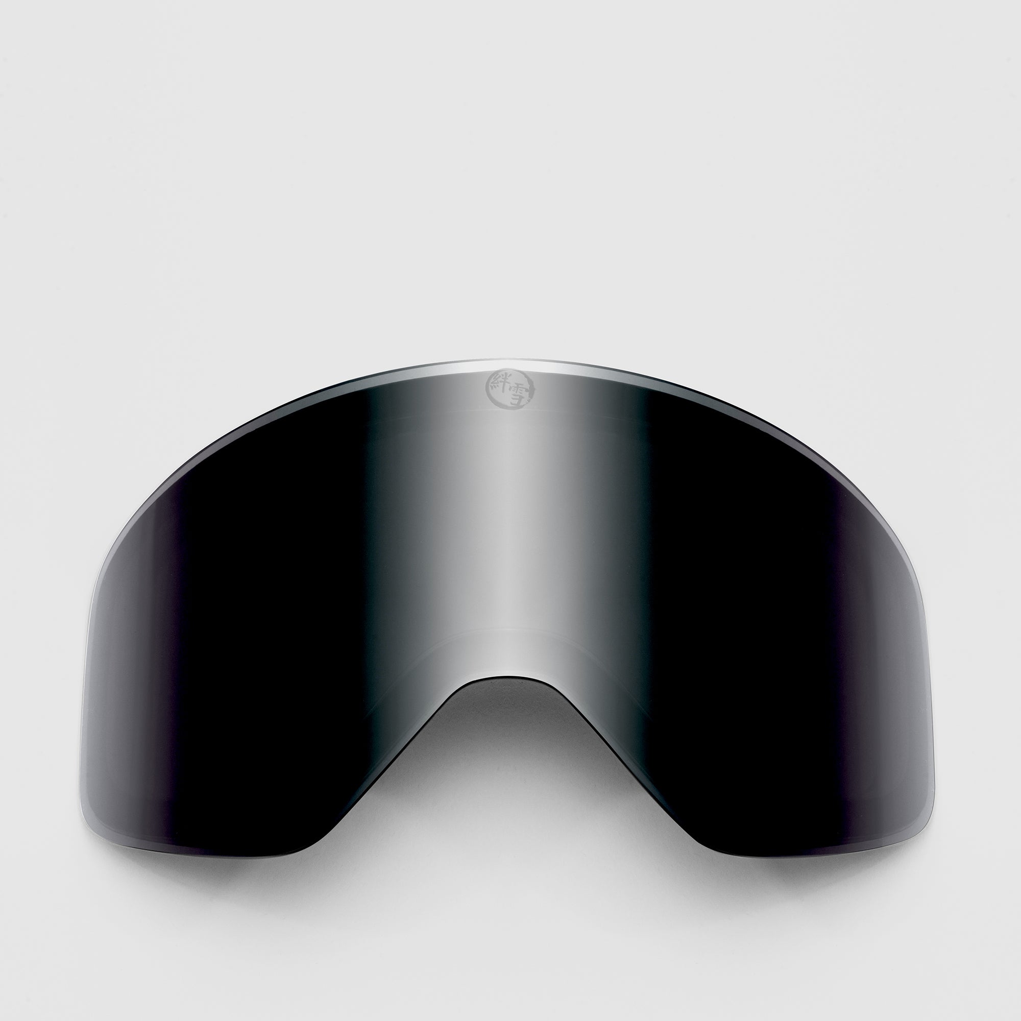 Black ski goggles lens on a light gray background