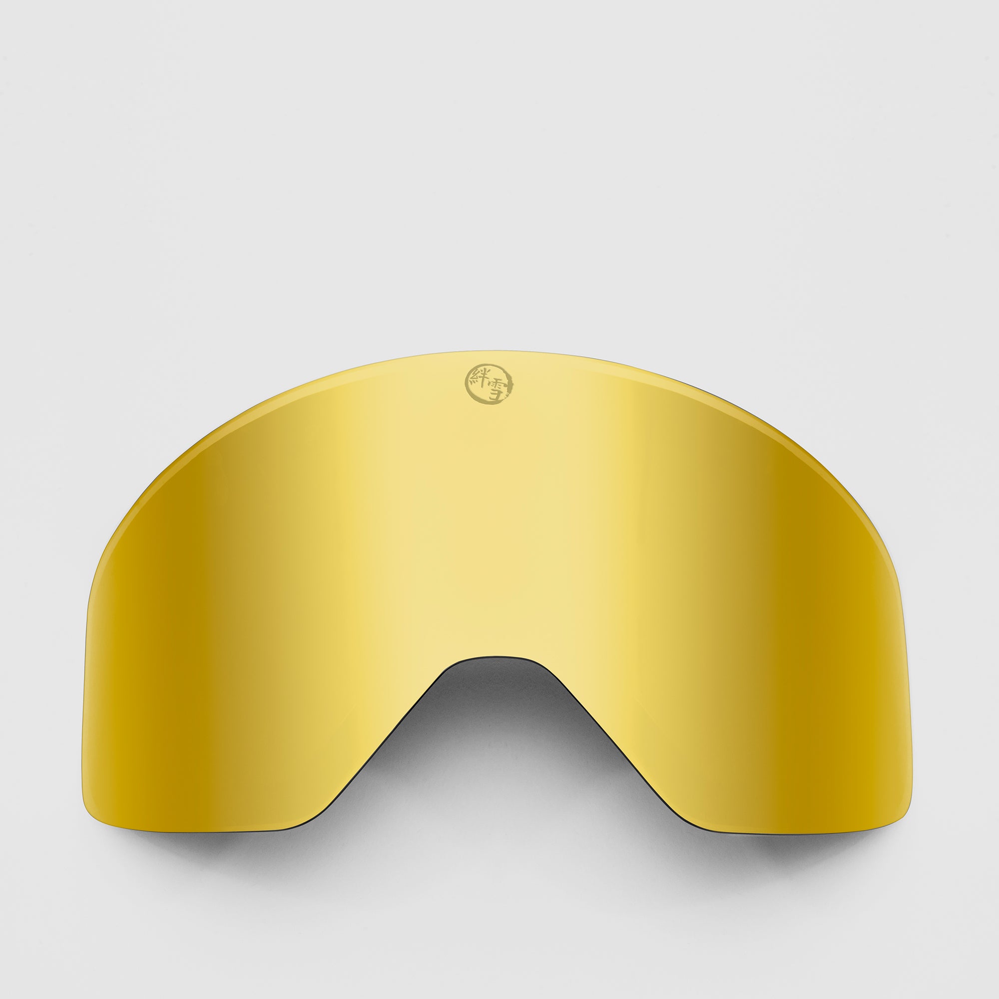Gold ski goggles lens on a light gray background
