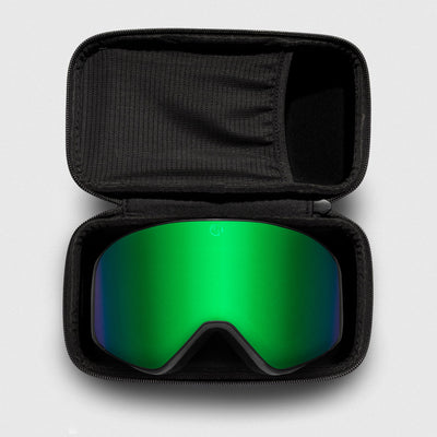 Green reflective ski goggles, with black frame in a black case on a light gray background
