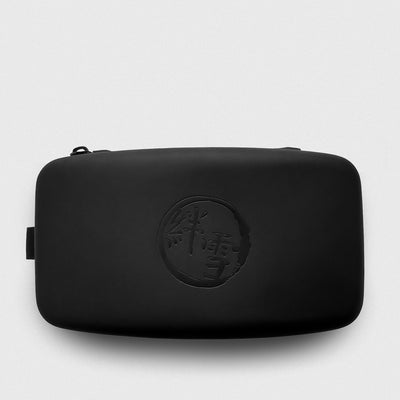 Black ski goggle case with embossed KIZUKI logo on a light gray background