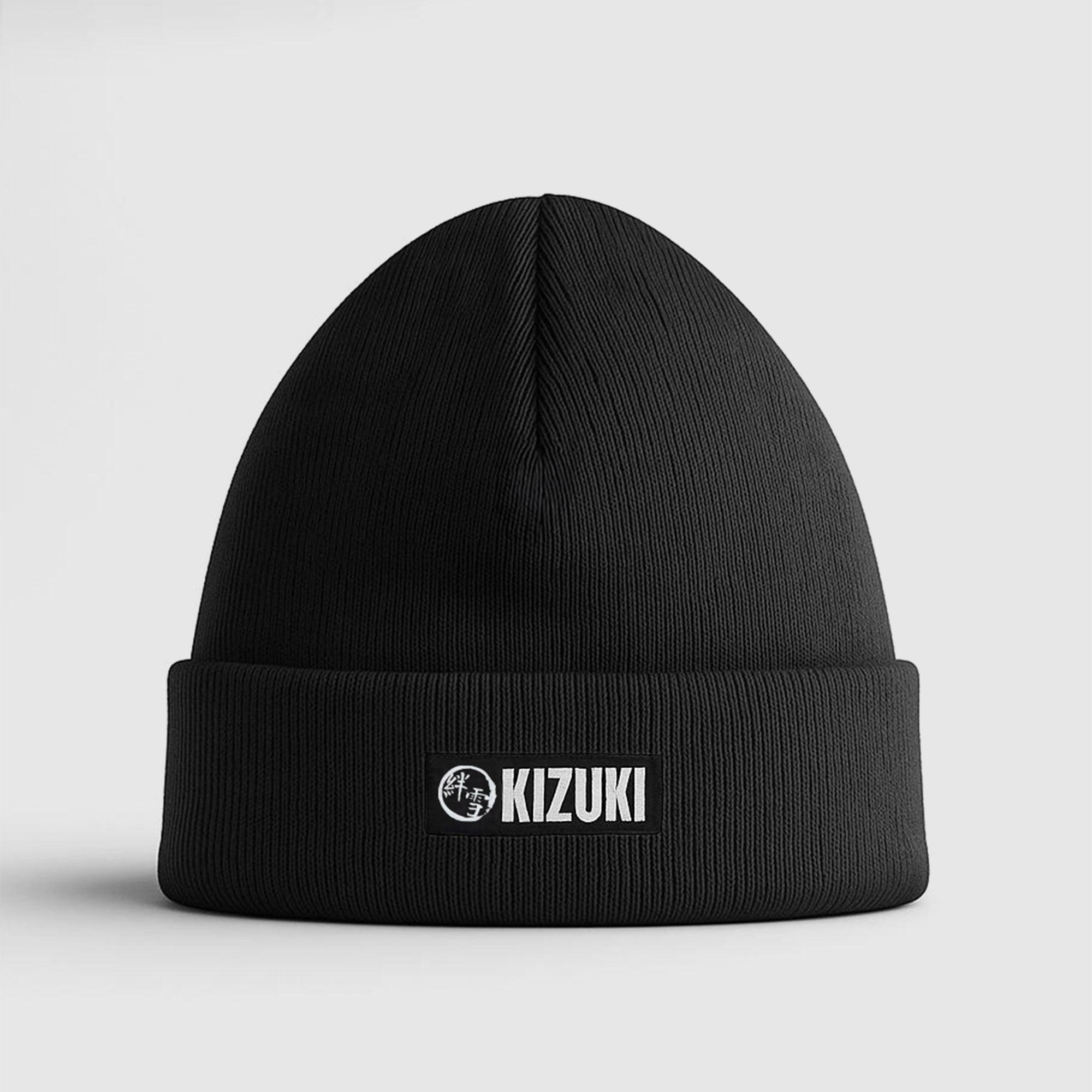 Black beanie with KIZUKI logo on a light gray background