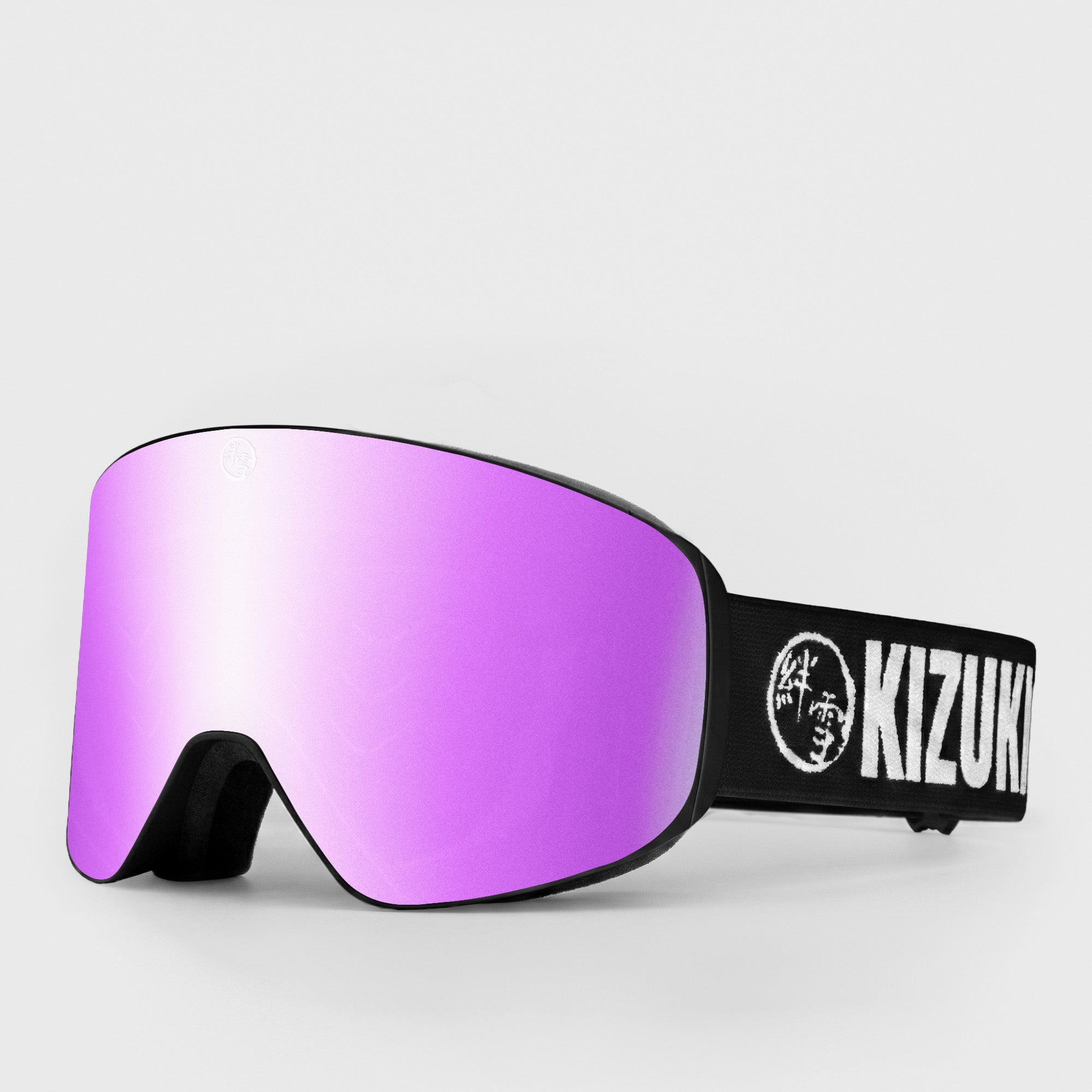 Pink ski goggle in standard size with black strap featuring 'KIZUKI' brand on a light gray background