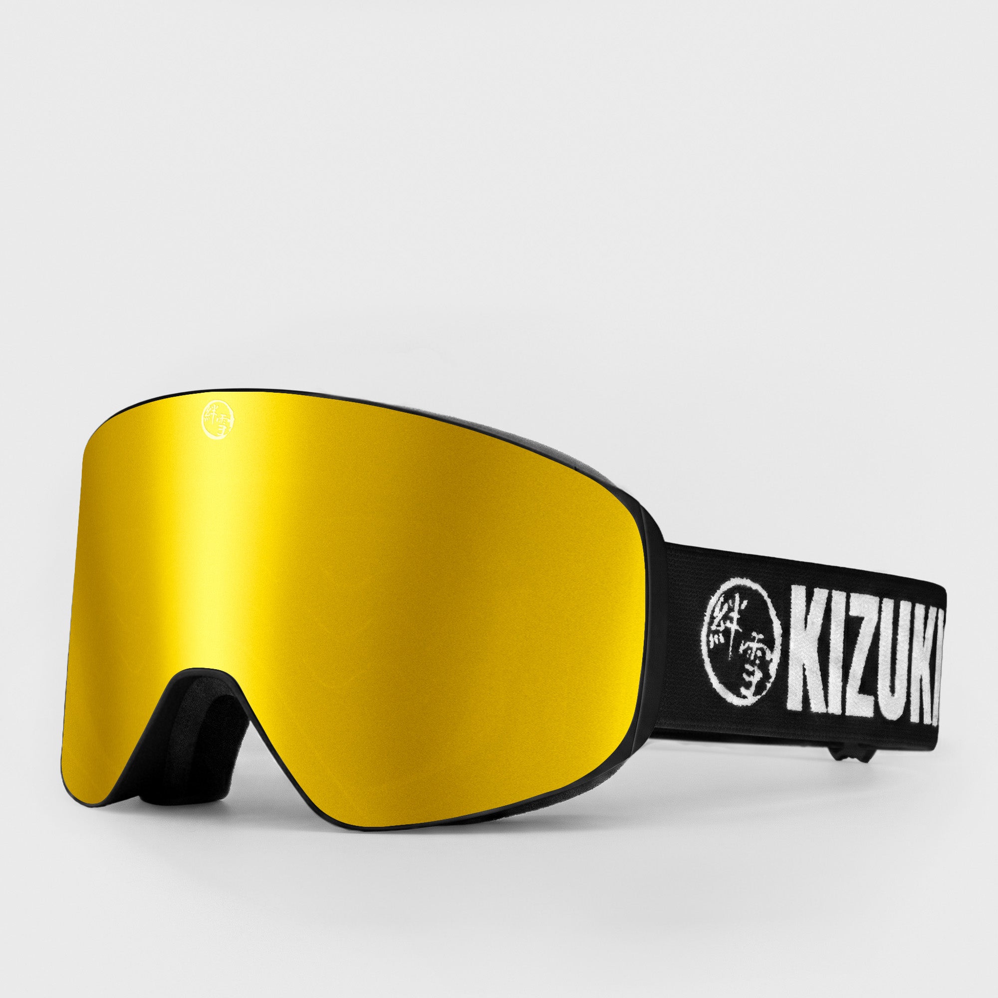 Gold ski goggle in standard size with black strap featuring 'KIZUKI' brand on a light gray background