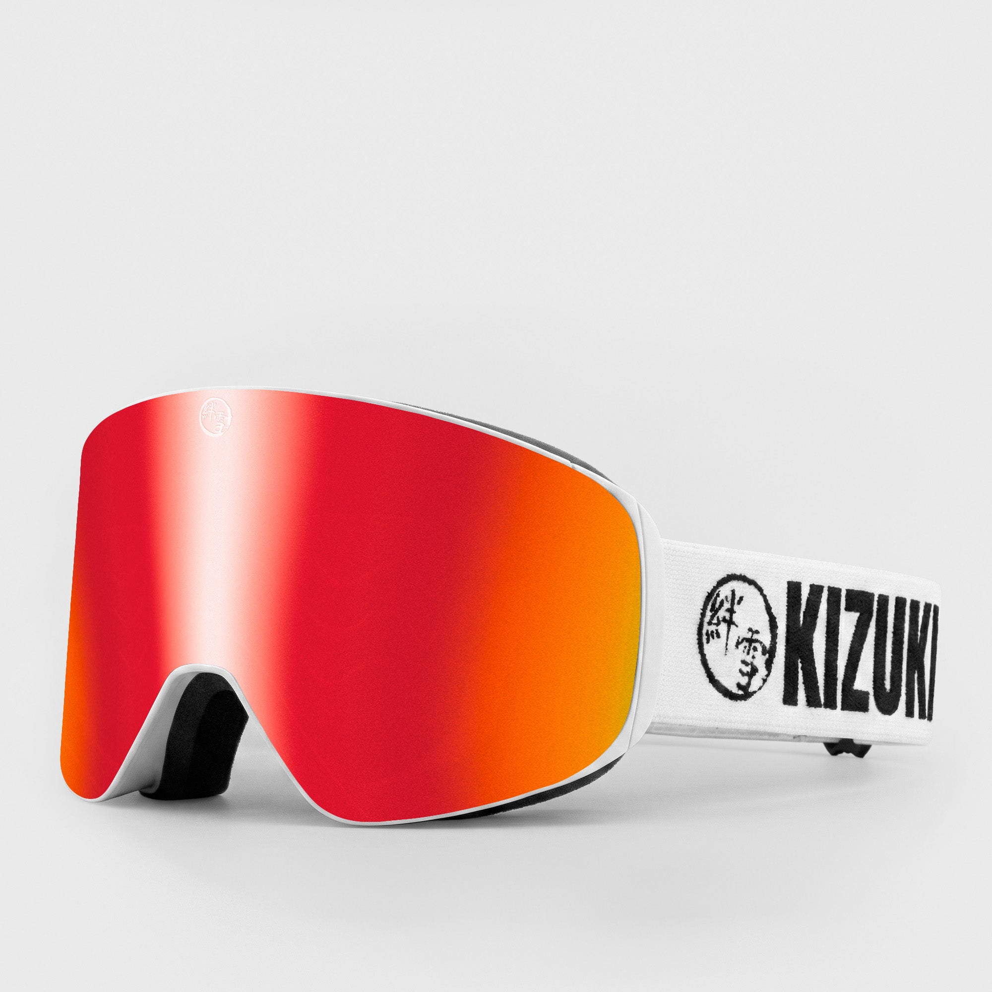 Red ski goggle in standard size with white strap featuring 'KIZUKI' brand on a light gray background