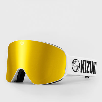 Gold ski goggle in standard size with white strap featuring 'KIZUKI' brand on a light gray background