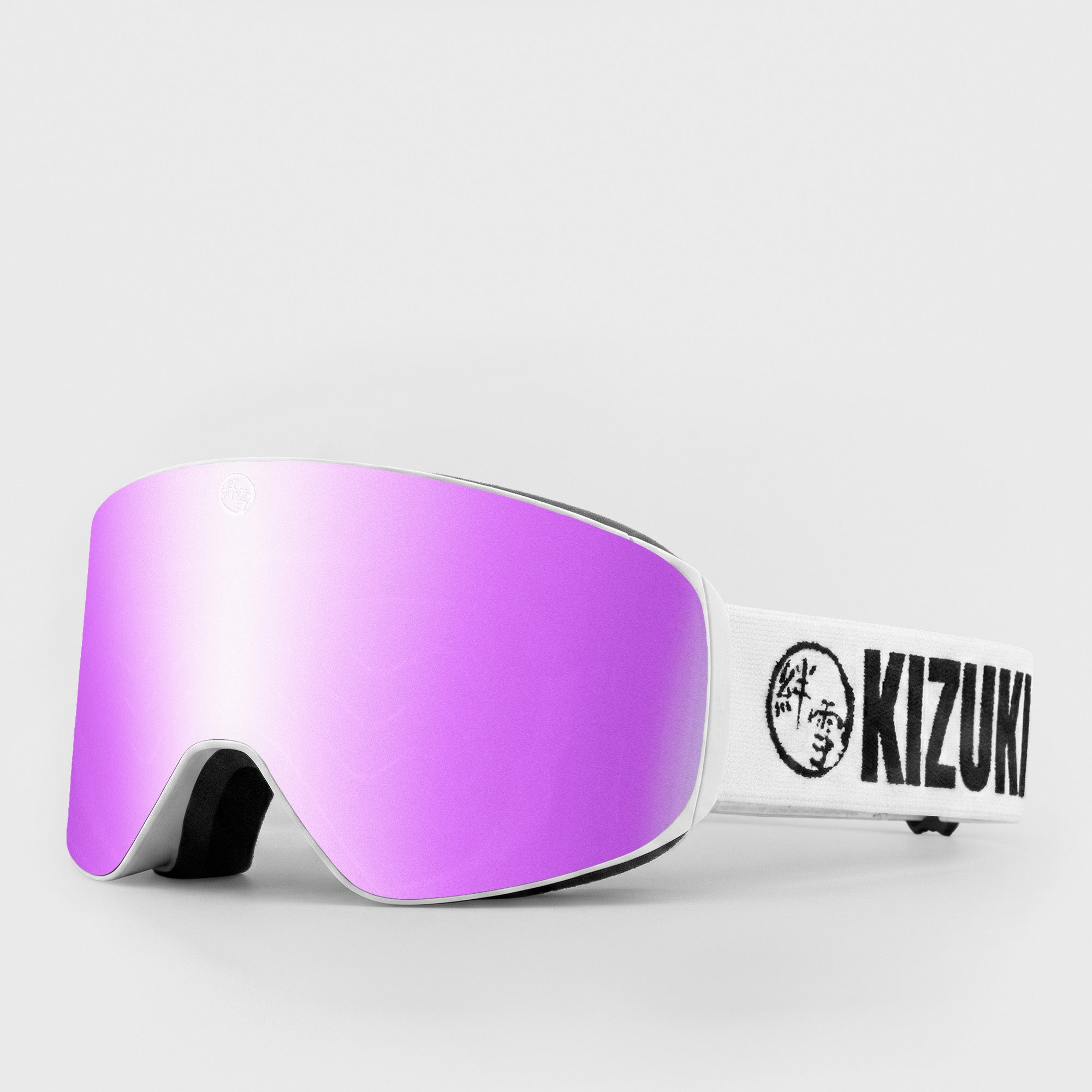 Pink ski goggle in slim size with white strap featuring 'KIZUKI' brand on a light gray background