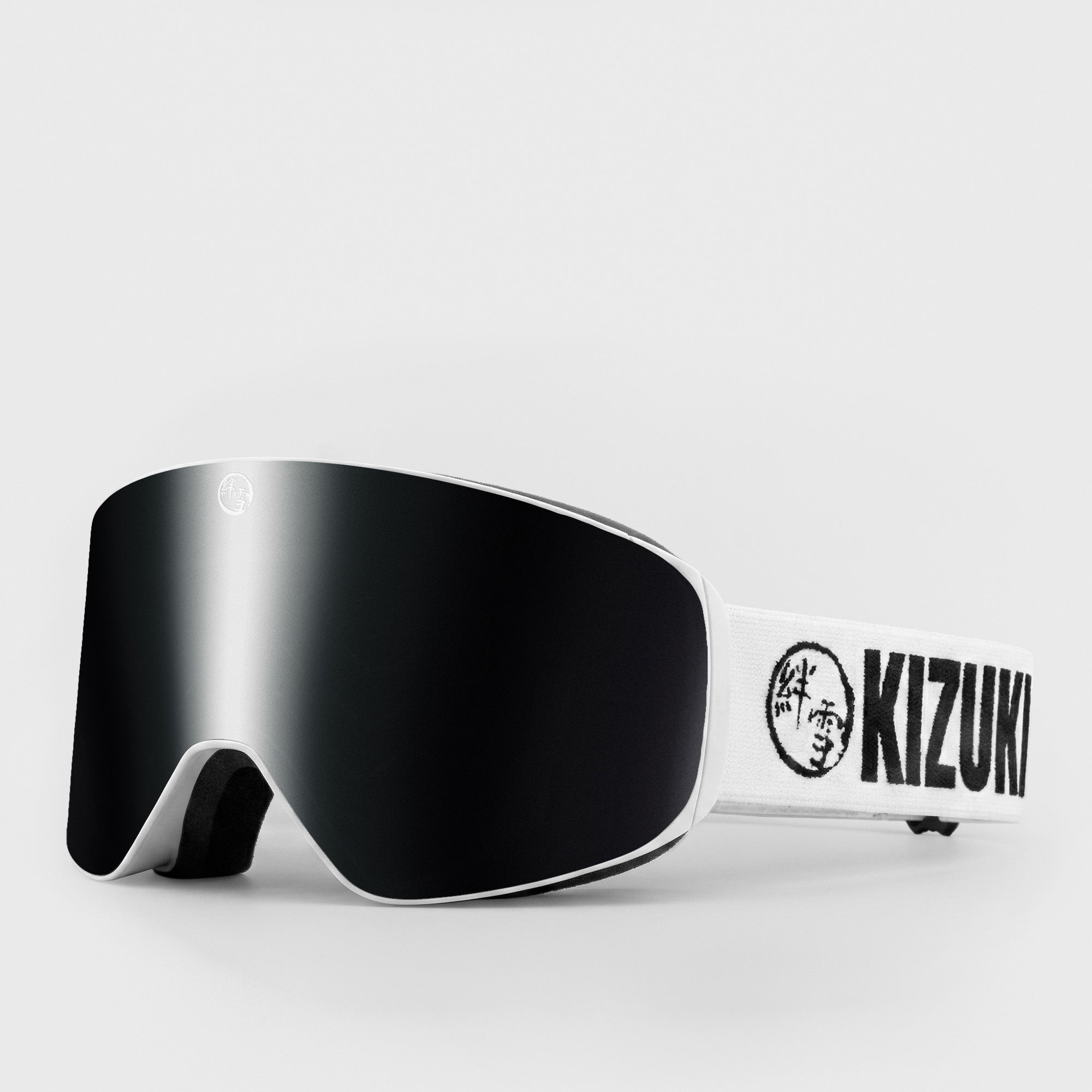 Black ski goggle in slim size with white strap featuring 'KIZUKI' brand on a light gray background
